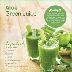 an advertisement for green juice on a wooden table with apples and celery in the background