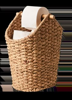 a woven basket with toilet paper in it