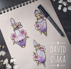 a notebook with some tattoos on it next to flowers and a pen, which reads david oska