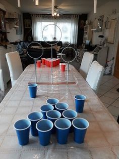 a table with blue cups on top of it