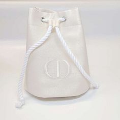 Christian Dior Women's Ivory White Lyocell Drawstring Makeup Cosmetic Bag Embrace Chic Functionality With The Dior Ivory White Lyocell Drawstring Makeup Bag Indulge In The Epitome Of Luxury And Practicality With This Stunning Dior Women's Ivory White Lyocell Drawstring Makeup Cosmetic Bag. Features: Brand: Christian Dior Type: Cosmetic Bag Size: Os Color: Ivory White Material: 100% Lyocell Lining: 100% Polyester Drawstring Logo On Front Spacious Bag For Carrying Size (Width X Height X Gusset): A Pink Cd, Drawstring Makeup Bag, Bags Christian Dior, Dior Cosmetics, Dior Makeup, Dior Beauty, Small Pouches, Drawstring Pouch, Makeup Pouch