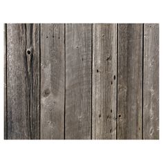 an old wooden fence with knots and nails on the boards is shown in this image