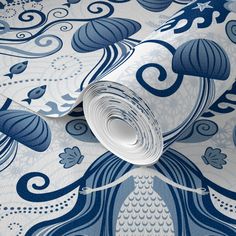 a blue and white wallpaper with an intricate design on it's surface,