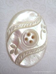 an image of a button that looks like it is made out of mother of pearl