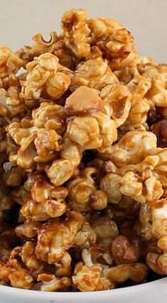 a white bowl filled with nuts on top of a table