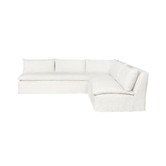 a white sectional couch with pillows on it's back and the seat folded out