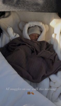 a baby wrapped in blankets is sleeping on a blanket with the caption, we'veldicia 3n