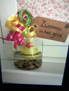 a jar filled with gold coins and a rubber duck