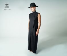 The Sentient Robe Dark Fashion Long ShirtCreated by our artisan tailors in our Bali atelier this Avant Garde androgynous robe is constructed out of lightweight linen. The snappers enclose the high collar on the neck whilst the upper trunk has a snug fit and sheer drop to the floor. An impactful yet simple black-look statement piece that blurs the boundaries and defies categorisation.  Please consult the measurement sheet (in the photo gallery) when deciding on a size.  If you have any questions Queer Fashion Guys, Androgynous Clothing, Rick Owens Outfit, Sleeveless Kimono, Androgynous Outfits, Black Look, All Jeans