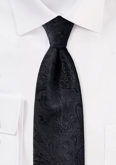 If you are planning a wedding that requires guests to wear black tie attire but are having trouble locating the appropriate accessory for the young boys in your wedding party, then you need look no farther than this Floral Paisley Tie in Jet Black for Kids. This piece is discreetly detailed, and it is decorated with a black flower design. It has all the beauty of a dainty classic necktie, and it is perfect for formal occasions. It is self-tied for your convenience, making it perfectly practical, Elegant Ties For Black Tie Events, Elegant Adjustable Accessories For Black Tie Events, Classic Black Tie For Wedding, Black Tuxedo Ties For Wedding, Black Standard Tie For Wedding Suits, Elegant Black Standard Tie And Suit Accessories, Elegant Black Suit And Tie Accessories, Classic Black Tie For Party, Elegant Black Ties For Black-tie Events