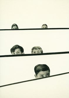 three people are looking through the bars in front of their faces and behind them is another man's head