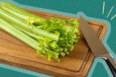 celery on a cutting board with a knife