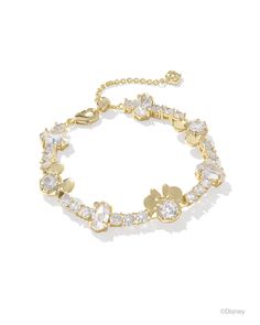 Celebrate joyful style and Disney fun with the Disney | Kendra Scott Gold Mickey Mouse and Minnie Mouse Tennis Bracelet in White Crystal. From the miniature iterations of Disney’s eternal sweethearts to its gorgeous crystal details, there’s so much to love about this timeless tennis bracelet. As elegant as it is whimsical, this wrist stack stunner will have you smiling ear to ear. Metal 14k Yellow Gold Over Brass Material White CZ Closure Lobster Clasp W/ Single Adjustable Slider Bead Size 6.5"W Gold Mickey Mouse, Disney Pandora Bracelet, Disney Charm Bracelet, Mickey Mouse And Minnie Mouse, Kendra Scott Bracelet, Disney Charms, Pandora Disney, Bar Jewelry, Greek Jewelry