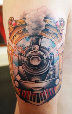 a man with a train tattoo on his arm