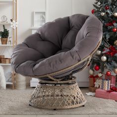 a chair that is sitting in front of a christmas tree