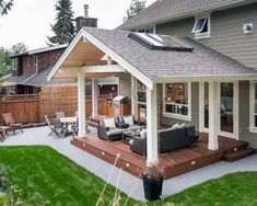 a house with a covered patio and seating area