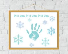 a poster hanging on a brick wall that says let it snow let it snow, let it snow