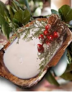 a piece of bread with cranberry sauce on it and greenery in the background