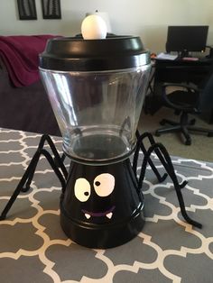 a blender with a face on it sitting on a table