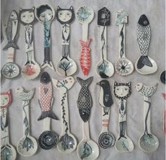 many spoons with different designs on them