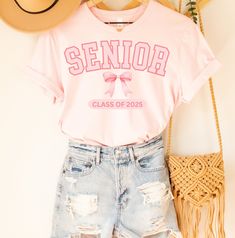 Senior Sunrise Shirt Back To School Senior Year 2025 Shirt Class of 2025 Bows Retro Senior Retro Shirt 2025 Seniors Tee Coquette Senior 2025 Retro Shirt, 2025 Senior Graduation Gift 📌IMPORTANT:  This soft Bella+Canvas light fabric t-shirt is a classic fit and runs true to size. ⭐️If you want an oversized look, please size up. Please refer to the size chart for specific shirt measurements.⭐️ 📌Our designs come to life through a professional direct-to-garment process, where fabric-grade ink is applied directly to the garment, ensuring a seamless integration with the fibers. The outcome is a collection of detailed and full-color prints that not only have a soft feel but also exude a charming vintage-style appeal across our diverse range of designs. 📌Please note that minor variations in colo Bedazzled Class Shirt, Cute Class Of 2023 Shirts, 23 Class Shirts, Pink Cotton College Shirt, Back To School Senior Year, Senior Year Things, Senior Graduation Gifts, Senior Sweatshirts, Senior Year Fun