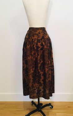 "Vintage Pierre Cardin skirt. Timeless couture piece. Cozy but lightweight. Great silhouette and floral print, side front brand pockets! Excellent vintage condition. 100% rayon. No size label. Laid flat, 13\" waist, 17\" hips, 35.5\" top to bottom." Vintage Skirt With Elastic Waistband In Relaxed Fit, Fitted Floral Print Skirt For Daywear, Vintage Bottoms With Elastic Waistband And Flowy Skirt, Vintage Flowy Skirt Bottoms With Elastic Waistband, Vintage Flowy Skirt Bottoms With Floral Print, Vintage Relaxed Skirt With Elastic Waistband, Vintage Long Skirt With Elastic Waistband, Vintage Floral Print Skirt For Fall, Vintage Relaxed Tiered Skirt