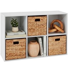 four wicker bins with baskets and books on the top one is white, the other is beige