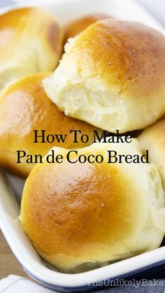 four rolls in a white baking dish with text overlay that reads pan de coco recipe