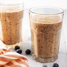 two glasses filled with blueberries and oatmeal