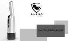 an electric toothbrush sitting on top of a white table next to a logo for rhino technology