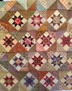 an old quilt with many different designs on it