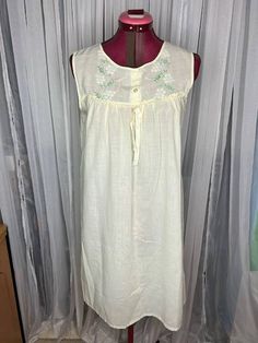 house dress Nightgown floral cotton yellow embroidered Size Small beautiful A line house dress or nightgown , love to the point of being sheer. has some speckled staining along the bottom.  Be aware that vintage sizes may vary from modern standard sizes. See the sizely chart in the product photos for full measurements. The measurements are the most accurate gauge of the garments size. bust, waist and hip measurements are taken laying flat and then doubled. all measurements are approximate. A Line House, Spring Vintage Cotton Nightgown, Yellow Nightgown, Dress Polkadot, Sleeveless Cotton Vintage Nightgown, Spring V-neck Nightgown With Lace Trim, Vintage Cream Sleeveless Nightgown, Vintage Formal Dresses, House Dress