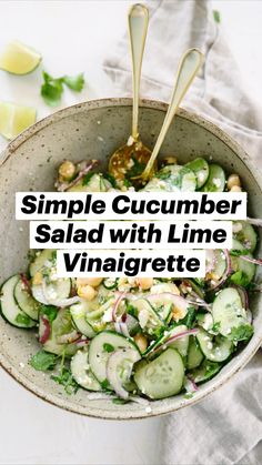 a bowl filled with cucumbers, onions and garbanzo beans on top of a table