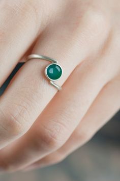 Sterling silver bypass green agate ring Are you looking for a delicate and simple jewelry for you or someone close to you? An everyday accessory in your favorite color or something little but precious that your friend can keep always with her? This green agate silver ring can be a great choice. The setting and the band are really subtle, but in the same time solid so it's not easy to damage it and you can wear this ring every day. The color of the gemstone is clear, deep and in a rather unique hue. The structure of the stone is regular, partly transparent so light penetrates it easily - because of it the stone changes it's color from deep green to a more delicate but still intense.  CHARACTERISTICS: * Material: sterling silver * Finish (you can see them on the last photo): rough/scratched Minimalist Green Jewelry With Simple Design, Green Sterling Silver Minimalist Ring, Green Minimalist Sterling Silver Ring, Minimalist Sterling Silver Open Emerald Ring, Minimalist Green Emerald Sterling Silver Ring, Minimalist Green Emerald Ring In Sterling Silver, Minimalist Green Agate Jewelry, Green Agate Ring, Green Stone Ring