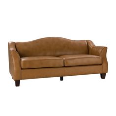 a brown leather couch sitting on top of a white floor