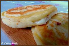 two pancakes sitting on top of a wooden table