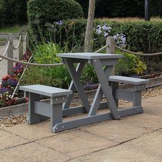 two benches sitting next to each other on a sidewalk