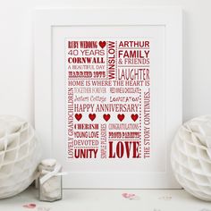 a red and white framed print with the words love written in different languages on it