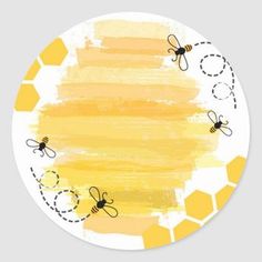 a round yellow and white sticker with bees on it