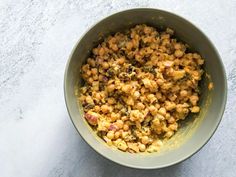 a bowl filled with food sitting on top of a table