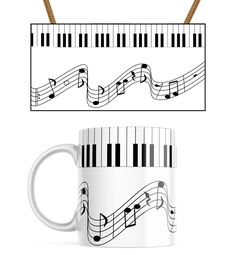 a white coffee mug with musical notes on the front and side, sitting next to a black piano keyboard