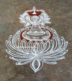 a drawing of a lotus on the ground in white and red with an intricate design