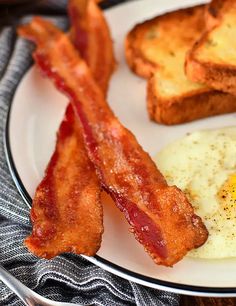 bacon, eggs and toast on a plate