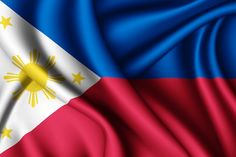 the flag of philippines is waving in the wind and it looks like silk or satin