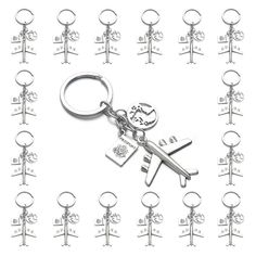 a bunch of key chains that are shaped like people with keys attached to them, all in different shapes and sizes