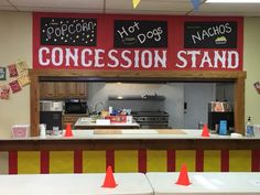 a kitchen with red and yellow cones in front of it that says, concession stand