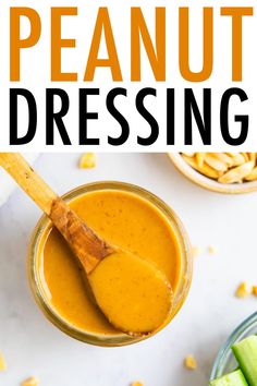 peanut dressing in a glass jar with a wooden spoon