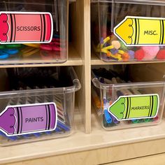 plastic containers filled with markers and crayons on the shelf