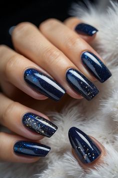 Create a starry night look on your nails with these 10 stunning nail designsFrom galaxy-inspired designs to sparkling star accentsthese nail art ideas will make your nails look out of this worldGet inspired and find the perfect starry night nail design for your next manicure. Dark Blue Designs Nails, Winter Sky Nails, Dark Blue Nails Winter, Navy Blue Nails Stars, Simple Dark Blue Nails, Navy Blue Nails With Stars, Dark Blue Aesthetic Nails, Navy Sparkle Nails, Acotar Nails Designs