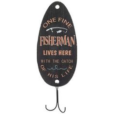 a sign that says fisherman lives here with the catch of his life hanging on a hook